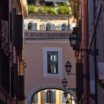 Archway and buildings in a narrow european street.